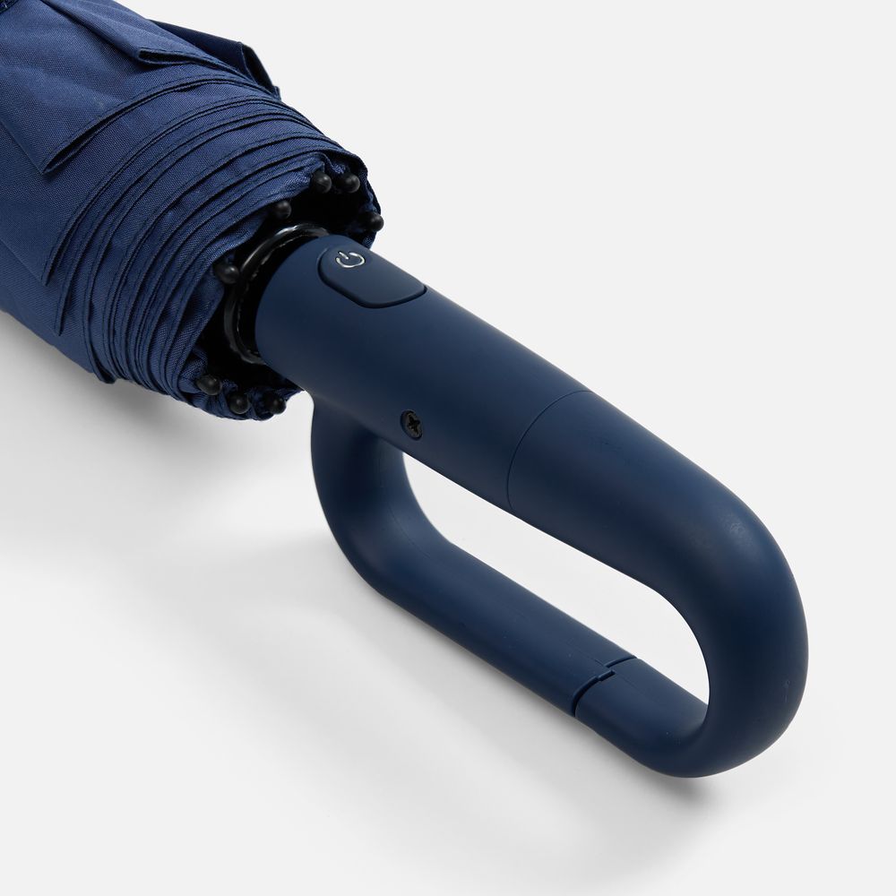 Close-up of automatic umbrella ring buckle handle and control button